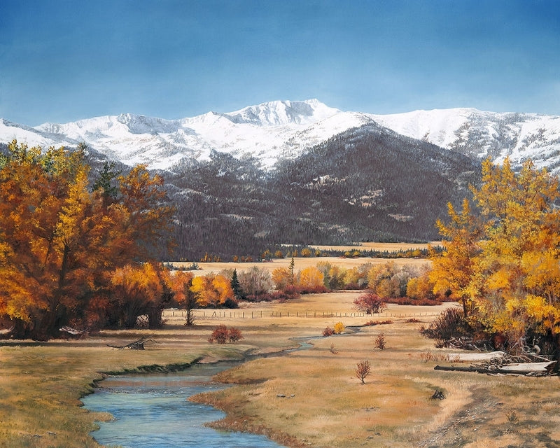 A scenic landscape painting of a mountain valley in autumn, featuring snow-capped peaks under a clear blue sky, golden yellow and orange trees, a winding stream in the foreground, and a dry grassy field.