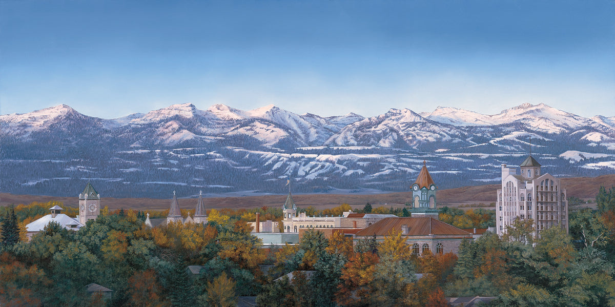 A scenic landscape artwork showing snow-capped mountains under a clear blue sky, with buildings and autumn trees in the foreground.