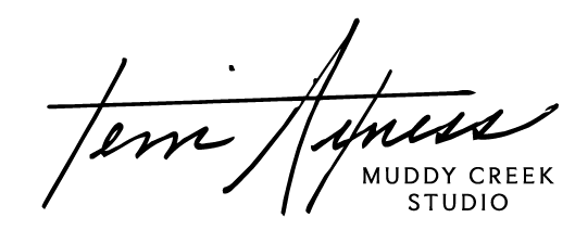 Signature Logo of multi-media and ceramics artist 'Terri Axness' owner and lead designer of 'Muddy Creek Studio' in Baker City, Oregon